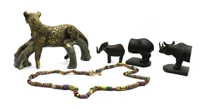 Lot 202 - A collection of modern African tribal items and lion figures