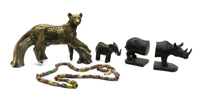 Lot 202 - A collection of modern African tribal items and lion figures