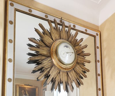 Lot 65 - Sir Noel Coward's wall-mounted sunburst perpetual dial timepiece