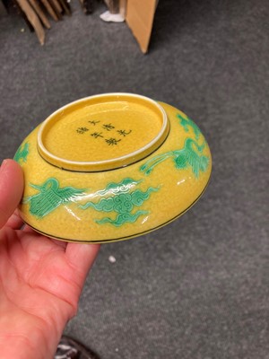 Lot 71 - A Chinese porcelain yellow ground saucer dish