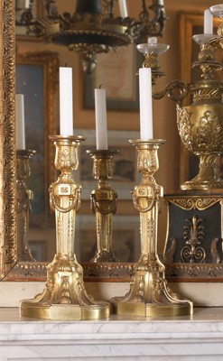Lot 113 - A pair of Louis XVI gilt-bronze candlesticks