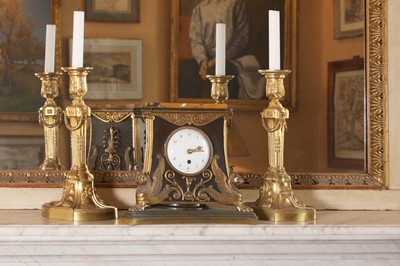 Lot 113 - A pair of Louis XVI gilt-bronze candlesticks