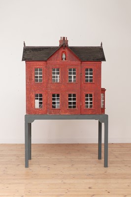 Lot 528 - A large painted doll's house on stand