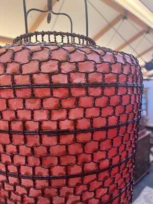 Lot 424 - A Chinese wirework and red paper globe lantern
