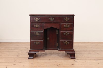 Lot 483 - A George III mahogany kneehole desk