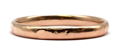 Lot 239 - A gold hollow court section arm bangle
