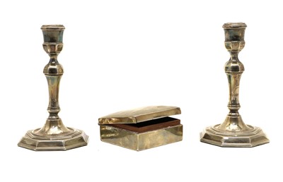 Lot 12 - A pair of Queen Anne style silver candlesticks