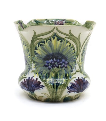 Lot 203 - A William Moorcroft pottery ‘Cornflower’ flower pattern jardinière