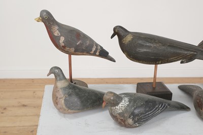Lot 416 - A flock of carved wooden and painted decoy pigeons