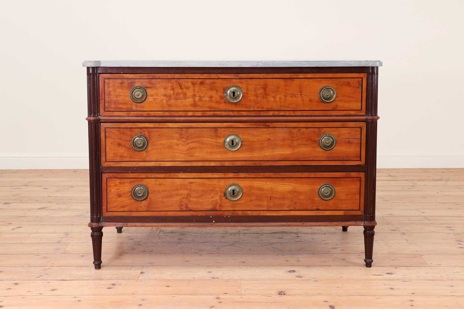 Lot 492 - A Louis XVI satinwood and mahogany commode
