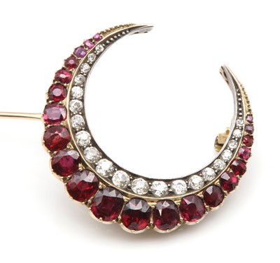 Lot 51 - A Victorian ruby and diamond closed crescent brooch, c.1890