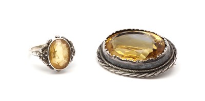 Lot 50 - An Arts & Crafts silver single stone citrine ring