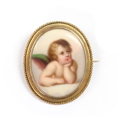 Lot 25 - A gold mounted porcelain plaque brooch