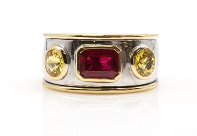 Lot 505 - An 18ct two colour gold ruby and yellow sapphire band ring