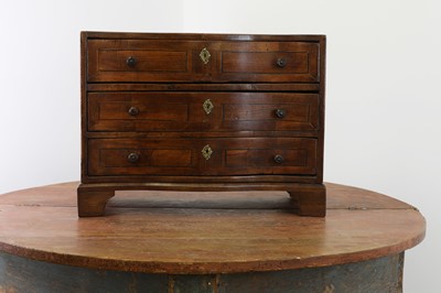 Lot 276 - A continental miniature walnut commode