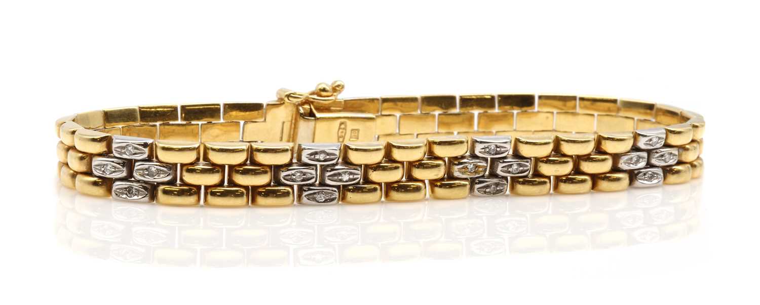 Lot 401 - An 18ct gold diamond set three row panther link bracelet