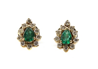 Lot 476 - A pair of gold emerald and diamond cluster stud earrings