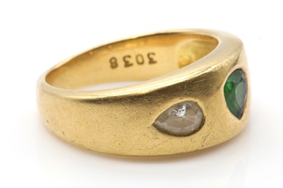 Lot 288 - A gold three stone tsavorite garnet and diamond ring, by Astral Gemstone Talismans
