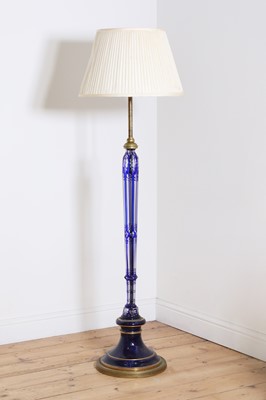 Lot 199 - An overlaid glass and brass standard lamp