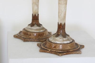 Lot 94 - A pair of Charles X alabaster and fruitwood candlesticks