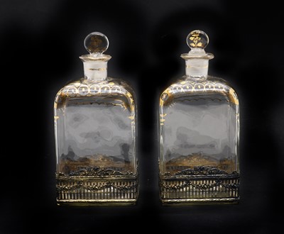 Lot 26 - A pair of silver-mounted glass decanters
