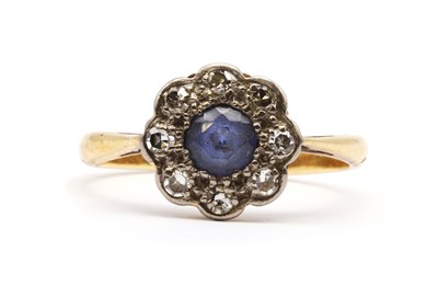 Lot 179 - A gold sapphire and diamond cluster ring