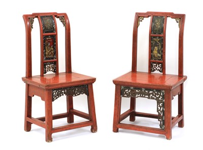 Lot 398 - A near pair of red lacquer low chairs