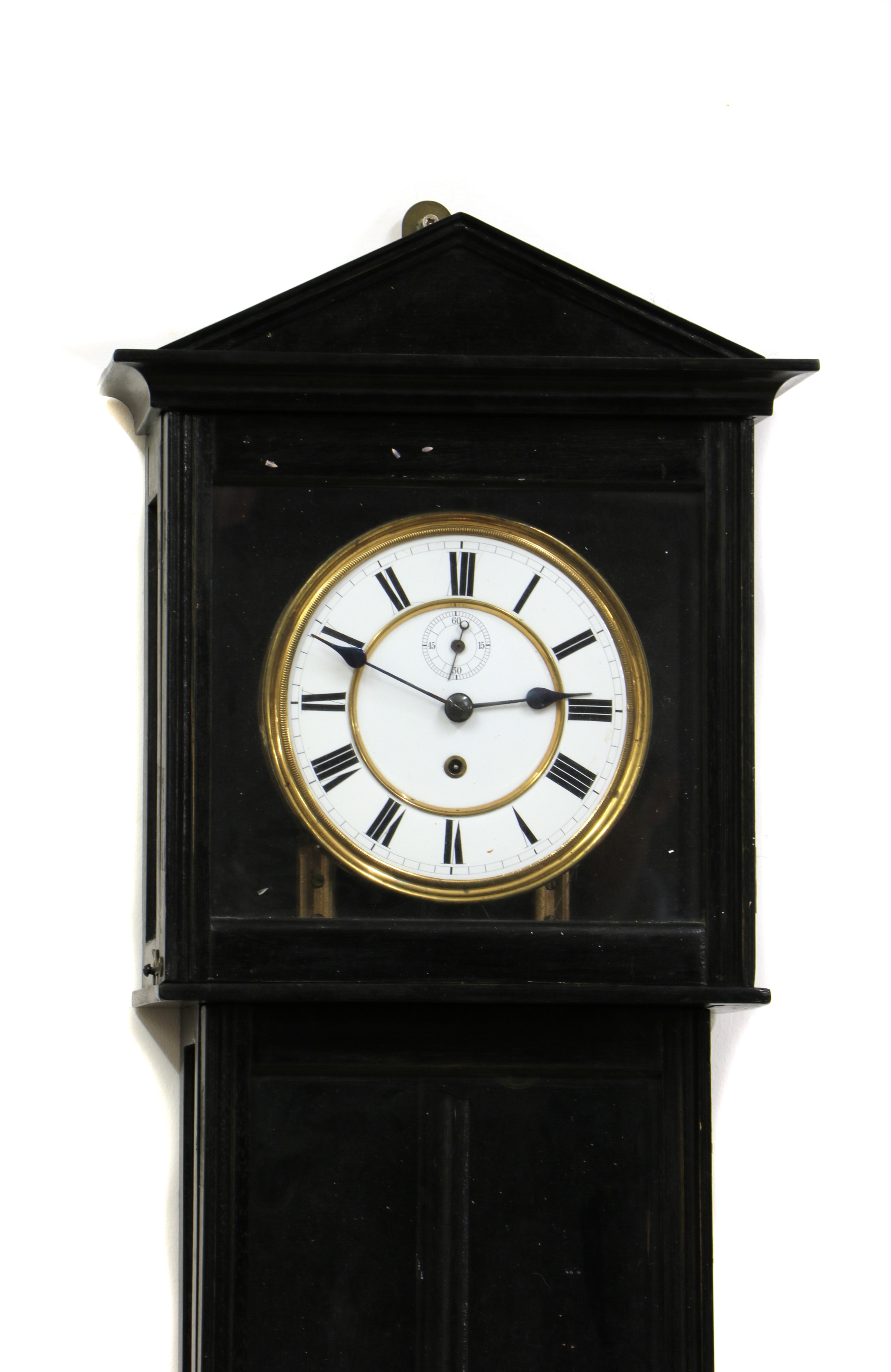 Lot 400 - An ebonised regular wall clock,