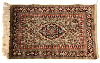 Lot 387 - A silk Kashan rug