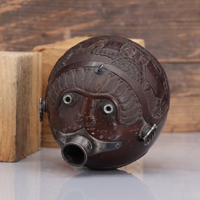 Lot 198 - A carved 'bugbear' coconut flask