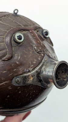 Lot 198 - A carved 'bugbear' coconut flask