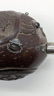 Lot 198 - A carved 'bugbear' coconut flask