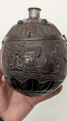 Lot 198 - A carved 'bugbear' coconut flask