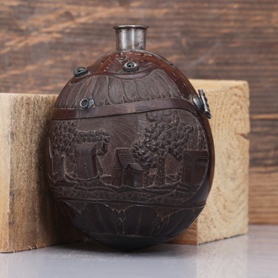 Lot 198 - A carved 'bugbear' coconut flask