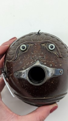 Lot 198 - A carved 'bugbear' coconut flask