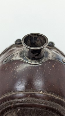 Lot 198 - A carved 'bugbear' coconut flask