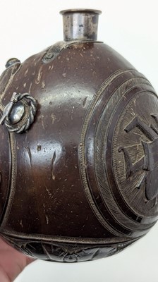 Lot 198 - A carved 'bugbear' coconut flask