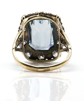 Lot 215 - An aquamarine and diamond rectangular cluster ring