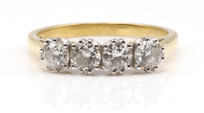 Lot 163 - An 18ct gold four stone diamond ring