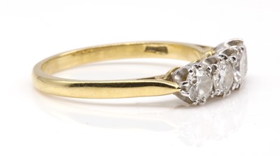 Lot 163 - An 18ct gold four stone diamond ring