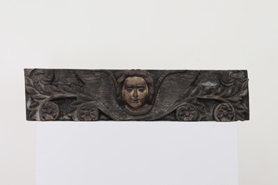 Lot 134 - A carved oak and polychrome painted fragment
