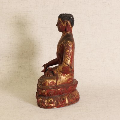 Lot 87 - A Chinese gilt lacquered wood Buddha