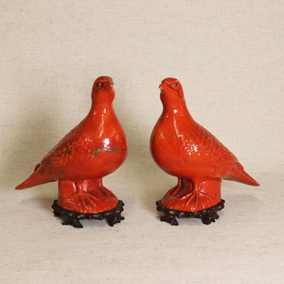 Lot 61 - A pair of Chinese export coral-red glazed pigeons