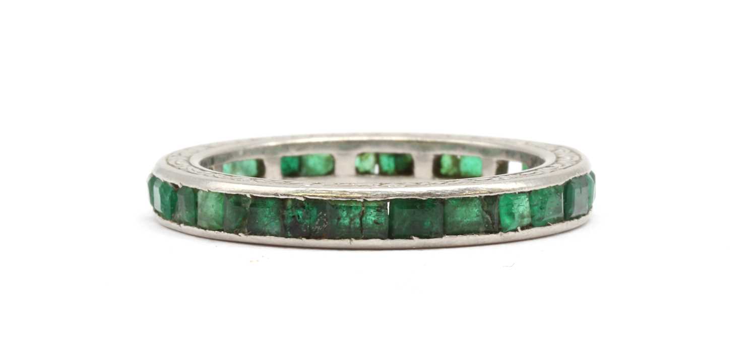 Lot 37 - An emerald full eternity ring