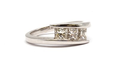 Lot 115 - An 18ct white gold three stone princess cut diamond ring