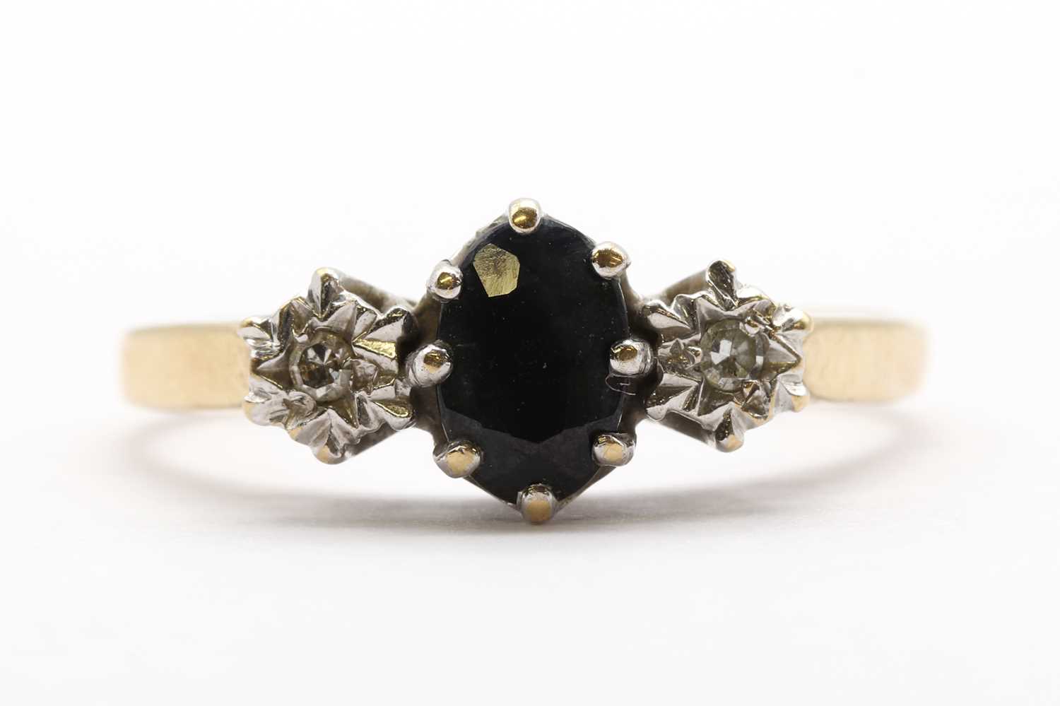 Lot 195 - A 9ct gold sapphire and diamond three stone ring