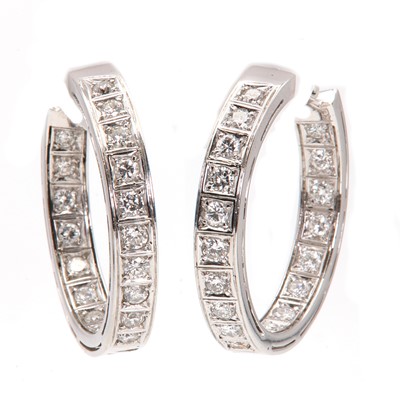 Lot 63 - A pair of Continental white gold diamond hoop earrings