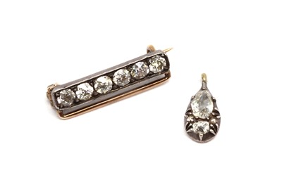 Lot 12 - A silver and gold diamond set bar brooch