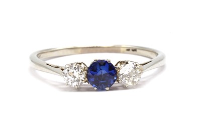 Lot 182 - A white gold sapphire and diamond three stone ring