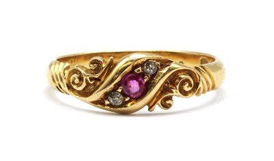 Lot 20 - An 18ct gold ruby and diamond three stone ring